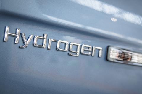 An image showing hydrogen writing in relief on car