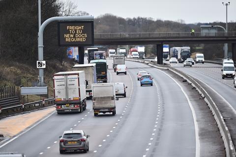 An image showing a motorway and a sign reading 'Freight to Eu new documents required' 