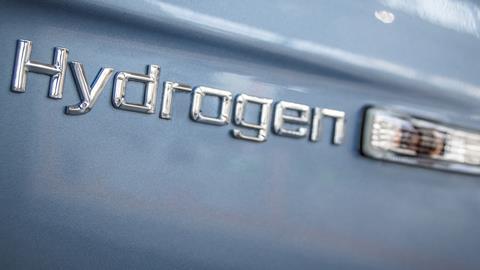 An image showing hydrogen writing in relief on car