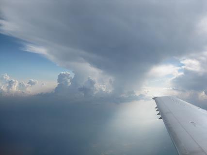 Aircraft flying beside a thunderstorm