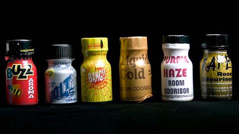 A photo of six small poppers bottles. Their colourful plastic wrappers advertise them as room odourisers or aroma with brand names such as Liquid Gold, Bolt and Purple Haze