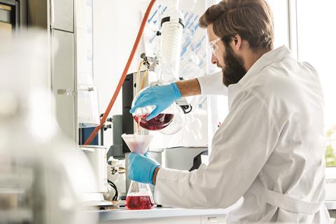Image shows a scientist in Dr Ehrenstorfer's lab