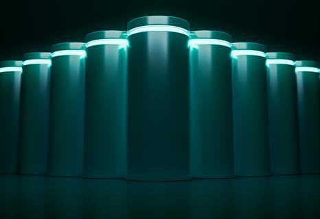Image showing line up of lithium-ion batteries on dark background