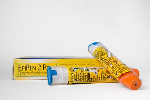 Two EpiPen auto-injectors used for treatment of allergic reactions.