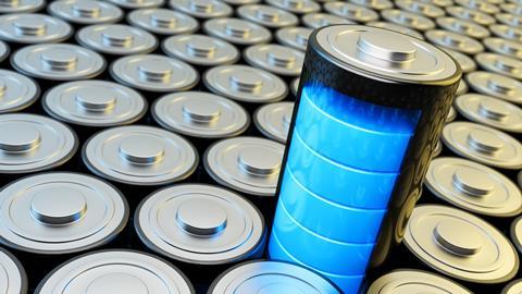 A battery stands above a columns of stacked batteries, displaying full power using five bright blue bars