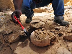 uncovering ancient pottery
