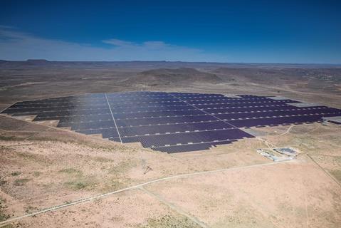 An image showing solar panels in the desert