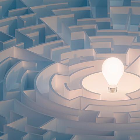 Illustration of lightbulb at the centre of a maze