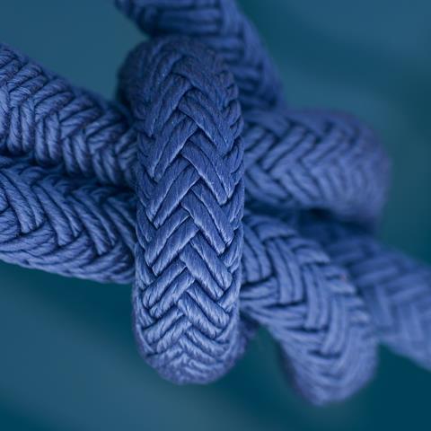 Image shows a rope tied into a knot