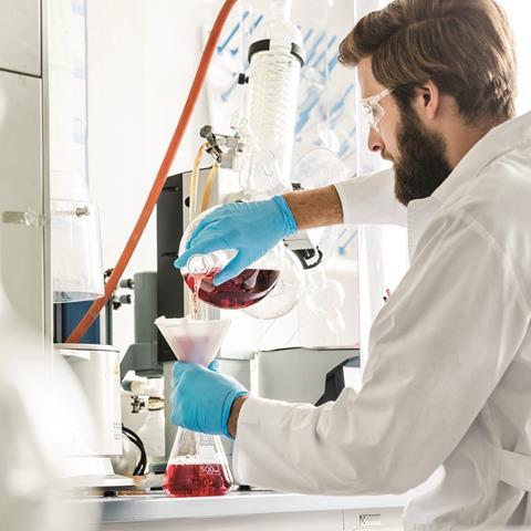 Image shows a scientist in Dr Ehrenstorfer's lab