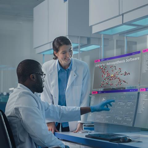 Lab with two scientists using SYNTHIA software on four futuristic projection screens