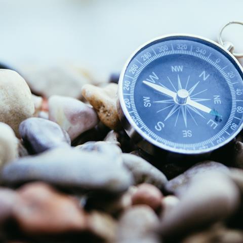 Magnetic compass on a pebble beach
