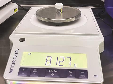Scales weighing a lunar sample