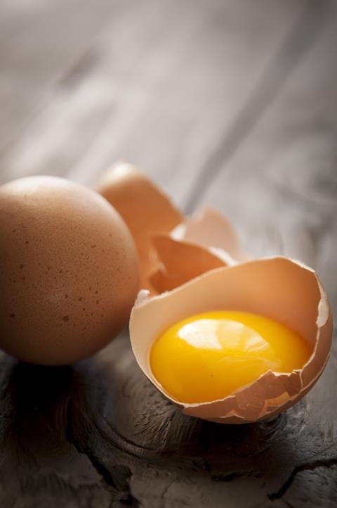 Egg yolk on table