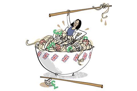 An image showing a woman sat in a giant noodle bowl holding a chopstick