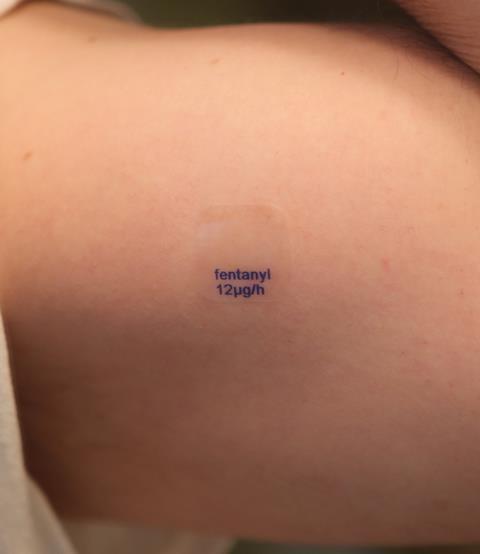 A generic fentanyl transdermal patch, with a release rate of 12mcg per hour, applied to the skin