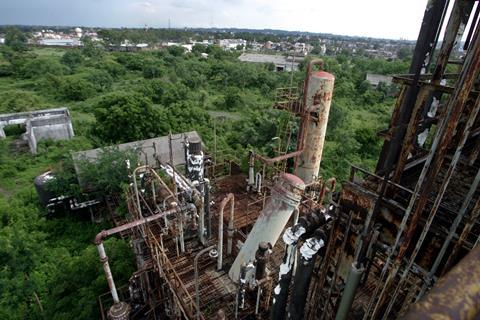 A photo of an old ruined chemical plant