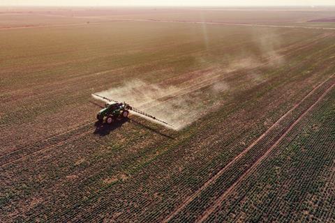 An image showing a tractor with a sprayer