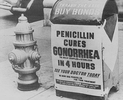 A poster attached to a curbside mailbox offering advice to World War II servicemen: Penicillin cures gonorrhea in 4 hours.