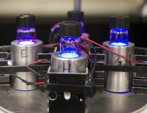 Photoredox setup showing illumination of reaction vials (Rochester University)