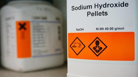 A container of sodium hydroxide pellets