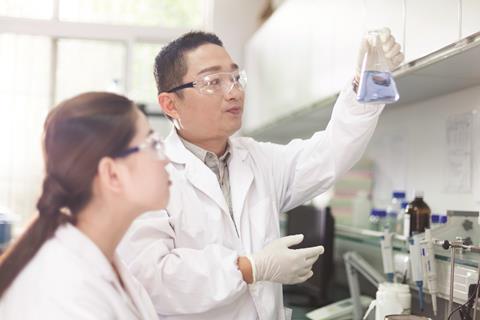 Chinese research scientists in laboratory