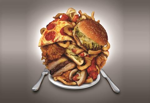 A piled up plate of junk food