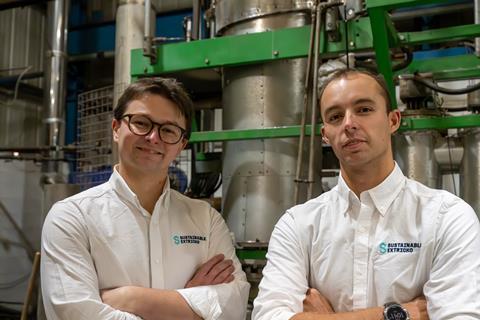 Sustainable Extricko team stand in front of reactor plant
