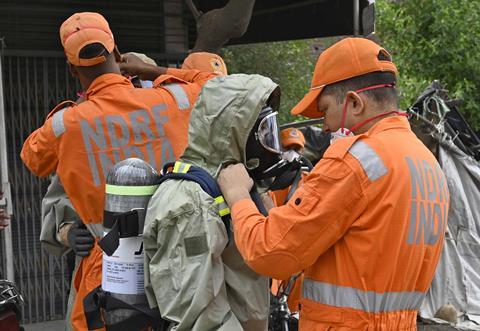 NDRF official and hazmat responders investigate the gas leak