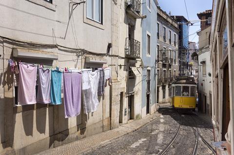 A picture of a tram on the streets of Lisbon