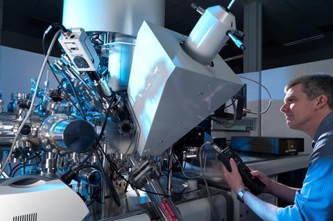 An image showing a man operating a XPS spectrometer