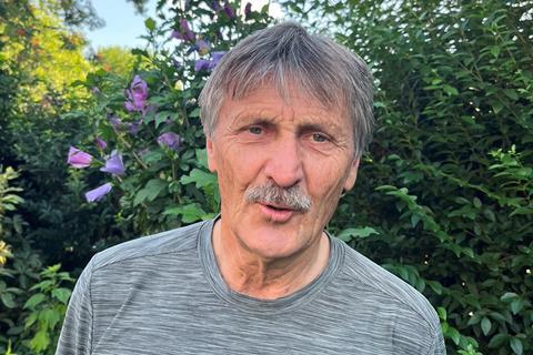 Rudy Dams headshot in a garden
