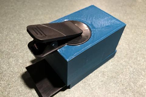 A photo of the first PathTracker clip-on box