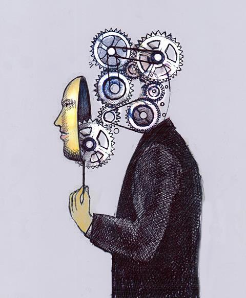 An image showing cogs behind a human mask