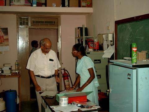Desiraju in a lab with a colleague
