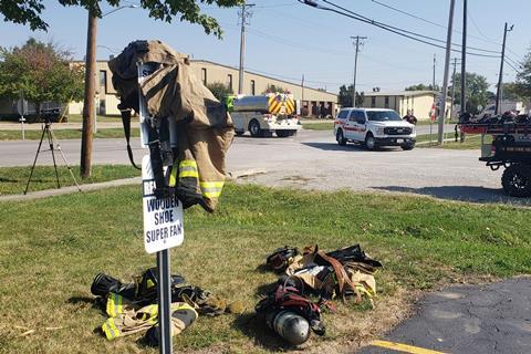 Firefighters' discarded uniforms outside Teutopolis High School