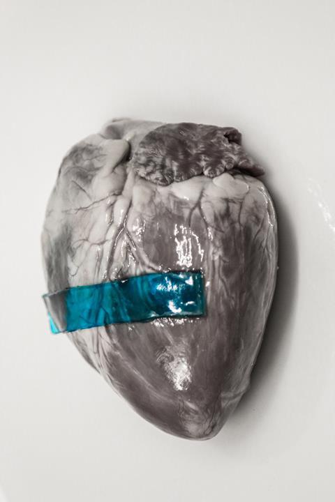 A blue strip of 'slug glue' on a heart