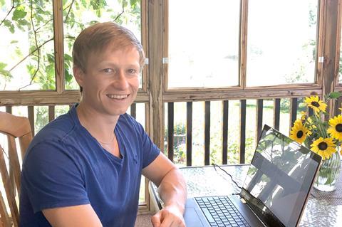 A photo of Anton Toutov with a laptop