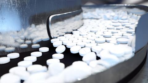 Image shows tablets on a production line 