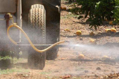 An image showing a tractor wheel with a sprayer