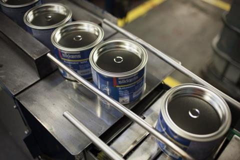 A photograph of Sikkens paint cans