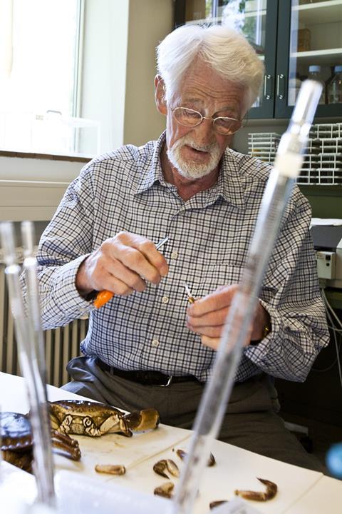 A photograph of Jen Christian Skou working in a laboratory