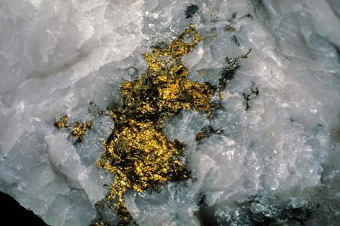 A nugget of gold trapped in quartz