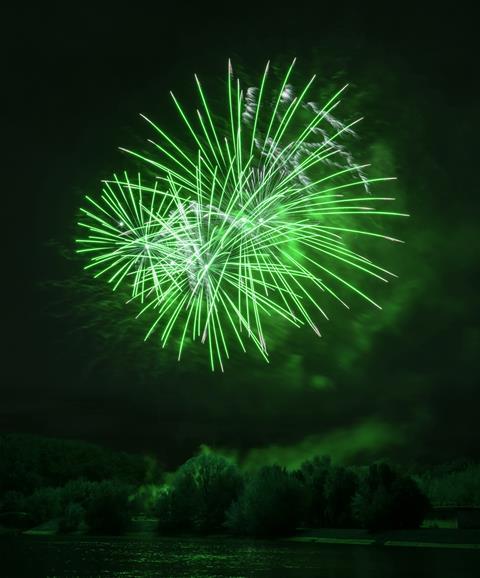 A photograph of green fireworks