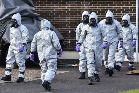 People in hazmat suits
