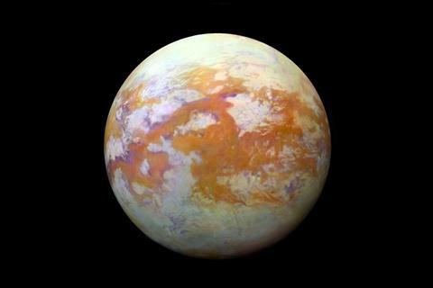 Saturn's moon Titan - showing the surface with red and white patches