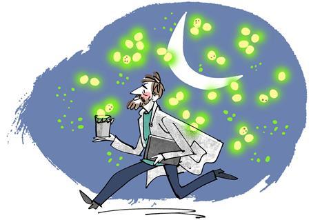 A scientist holding a cup of glowing blobs