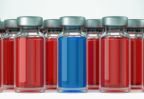 Several ampules containing a red solution and one containing a blue solution