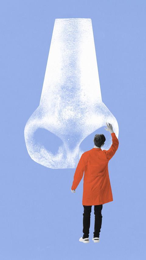 Scientist looking inside nose