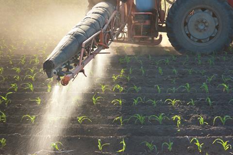 Agricultural crops being sprayed